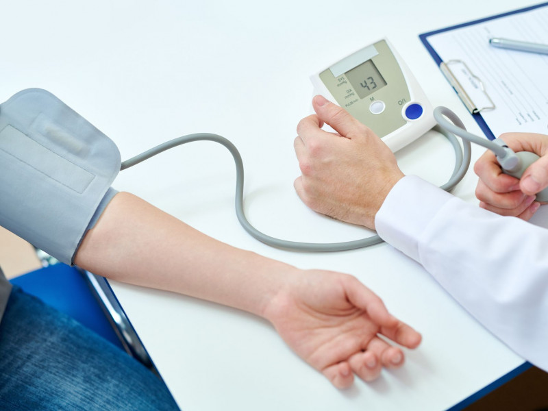 A woman receiving a blood pressure test