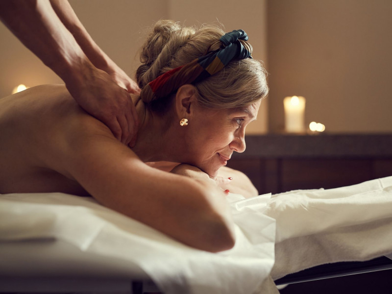 A senior woman getting a massage