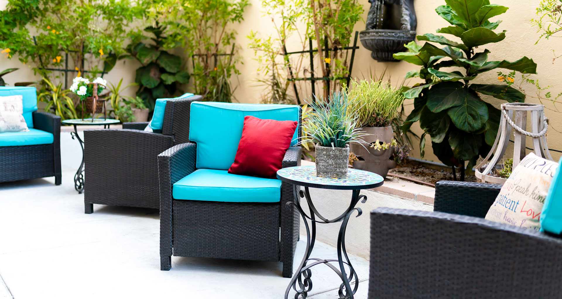 An outdoor patio area with seating and plants