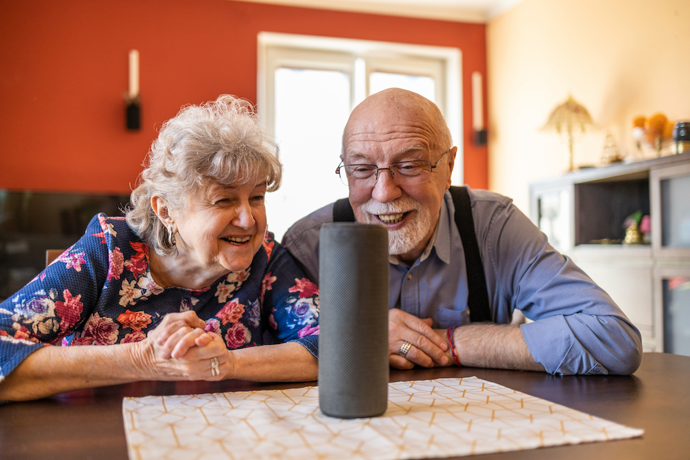 Senior couple using an at-home virtual assistant