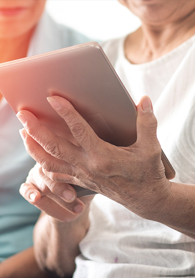 Senior woman using iPad to connect to others