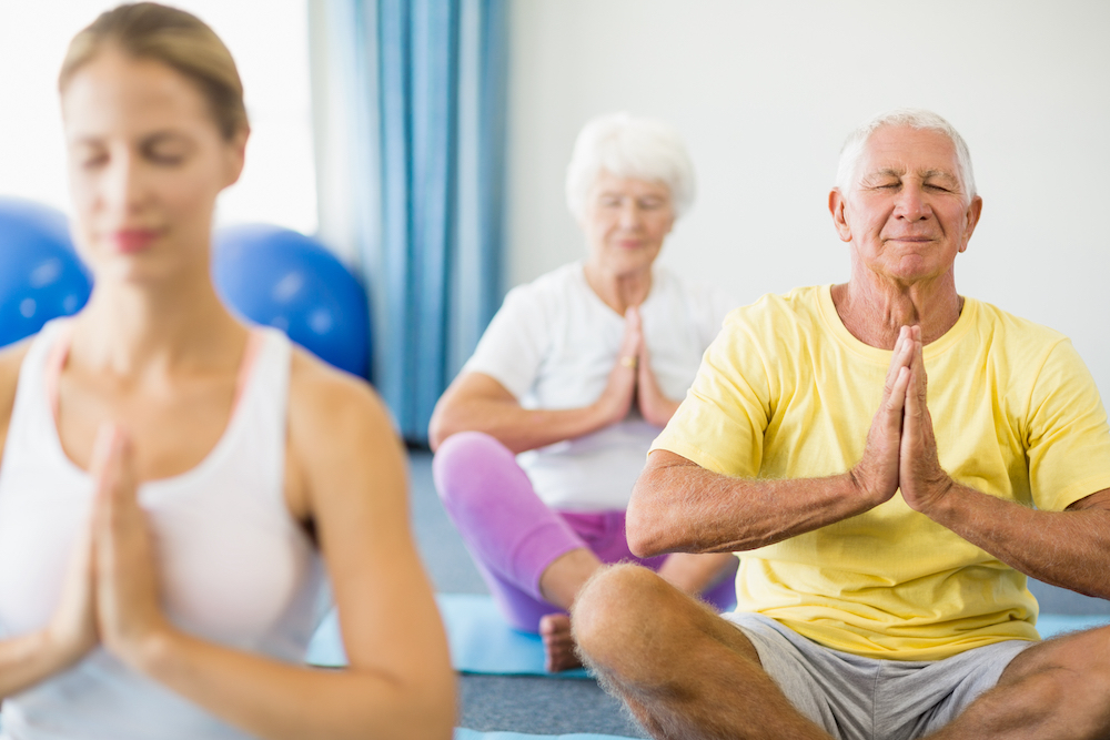 A group of Oceanside seniors attend yoga class