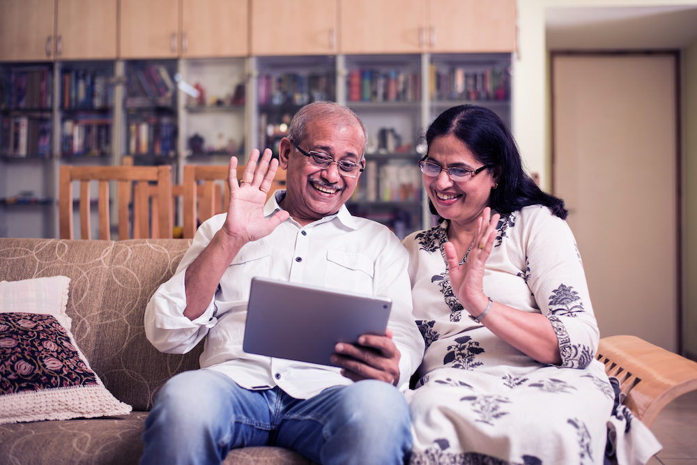 An older couple talks on video chat