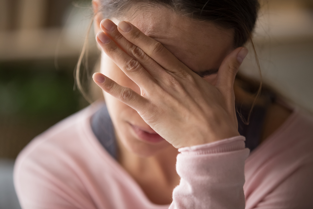 A female caregiver feeling stressed
